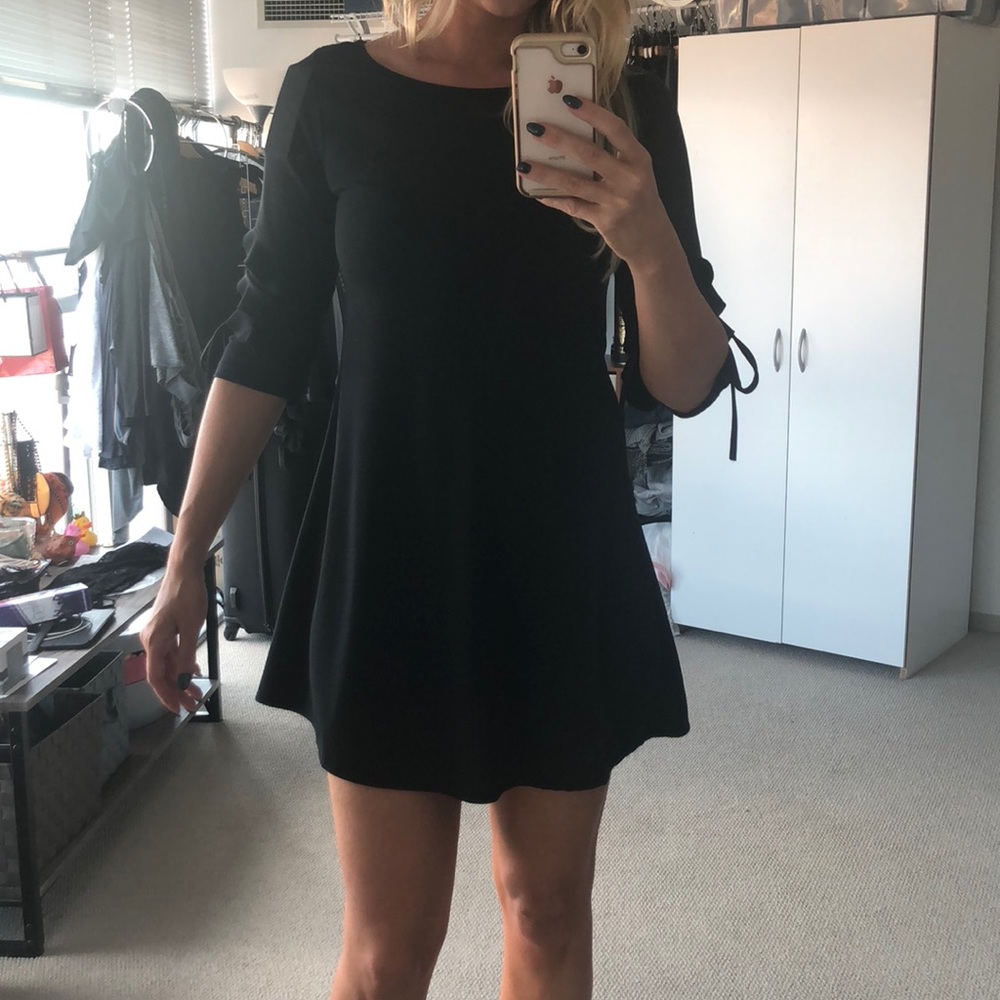 Black mini dress with ruffle sleeve detail